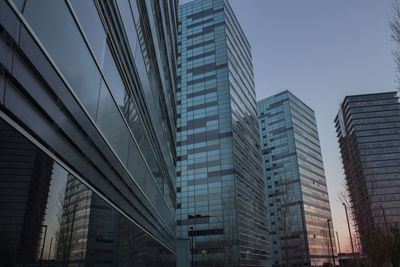 Low angle view of modern buildings against clear sky