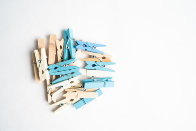 High angle view of colored pencils on white background