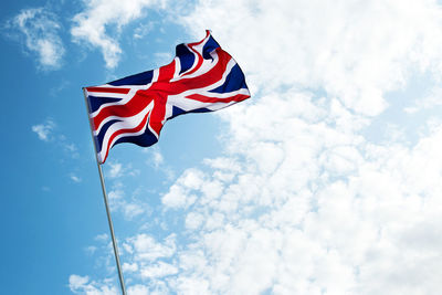 Low angle view of flag against sky