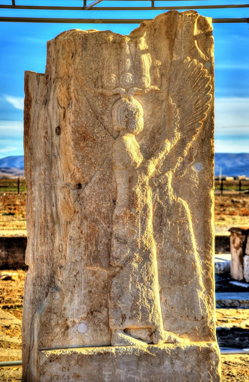 CLOSE-UP OF OLD SCULPTURE ON LAND