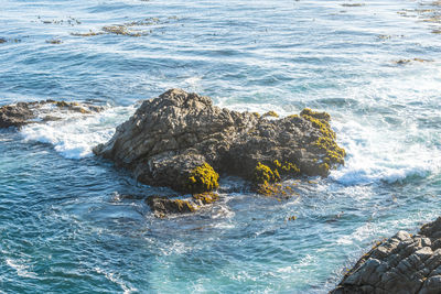 High angle view of rocks in sea