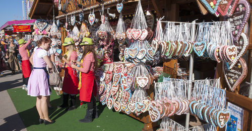 Women for sale at market stall
