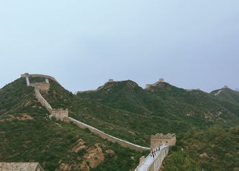 Old ruins on hill against sky