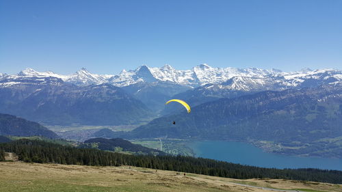 Scenic view of mountains against clear blue sky