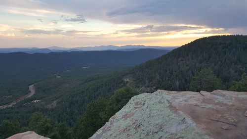 Scenic view of mountains against sky during sunset