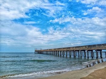 Pier over sea against sky