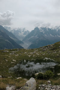 Scenic view of landscape and mountains against sky