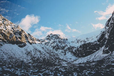 Snow covered mountains against sky