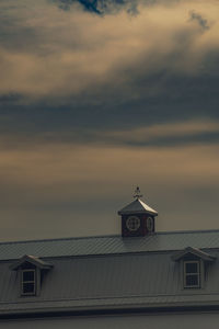 Low angle view of building against sky during sunset