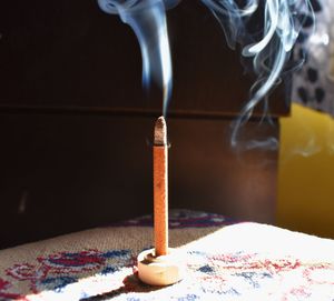 A essence stick with smoke in the air 