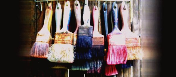 Clothes hanging in row for sale at market stall