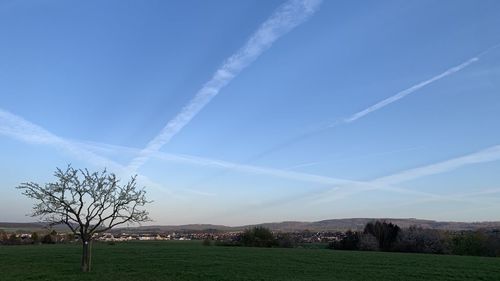 Scenic view of vapor trails in sky