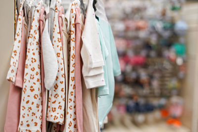 Close-up of clothes hanging in store