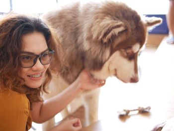 Portrait of young woman with dog