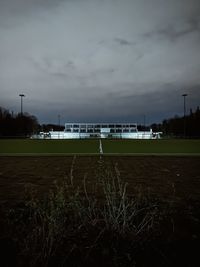 Scenic view of field against sky at dusk