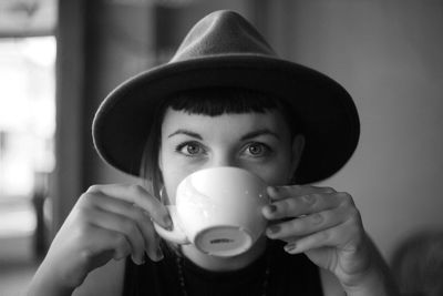 Close-up of woman holding camera