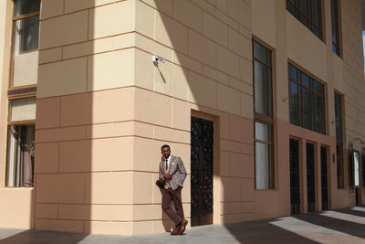 Businessman standing outside building