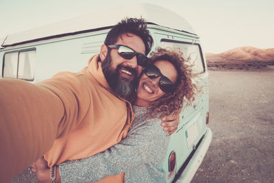 Portrait of happy couple at beach