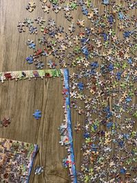 High angle view of multi colored umbrella on wood