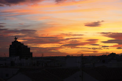 Silhouette of city during sunset