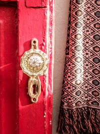 Close-up of red decoration hanging on wall