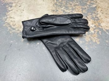 Close-up high angle view of leather gloves