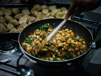 Close-up of person preparing food in kitchen