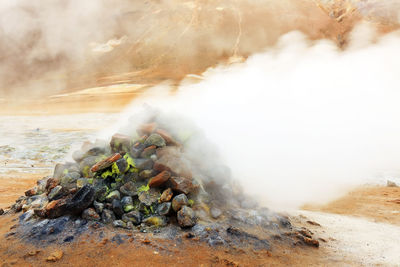 Smoke emitting from volcanic landscape