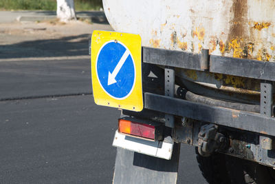Road warning signs on repair vehicles close-up.