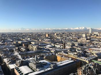 High angle view of townscape against clear blue sky