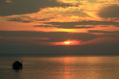 Boat silhouette, early morning, different perspectives, near and far