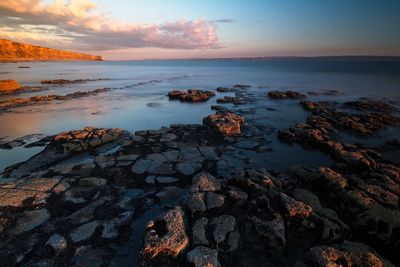 Scenic view of sea against sky during sunset