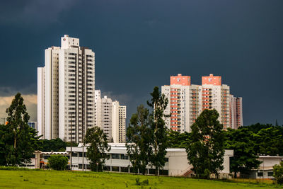 Buildings in city against sky