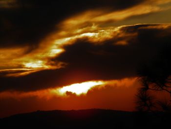 Low angle view of dramatic sky during sunset