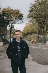 Portrait of young man standing outdoors