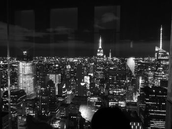 High angle view of illuminated city buildings at night