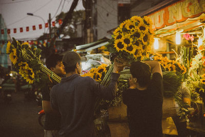 Panoramic view of people on street in city