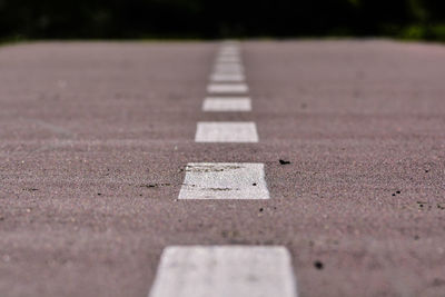 Close-up of arrow symbol on road