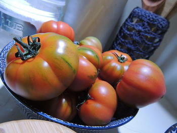 High angle view of tomatoes in plate on table