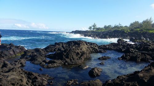 Scenic view of sea against blue sky