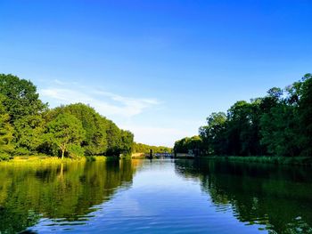 Scenic view of lake against blue sky