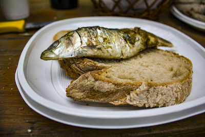 Grilled sardine on a piece of bread