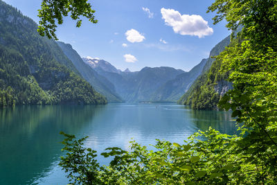 Scenic view of lake and mountains against sky