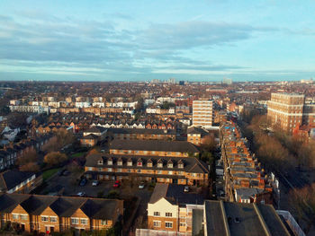 High angle view of buildings in city against sky