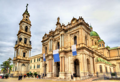 Facade of historic building against sky