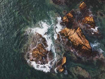 High angle view of rock formation in sea