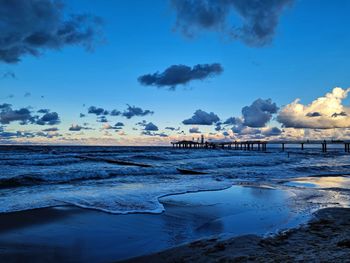 Scenic view of sea against blue sky