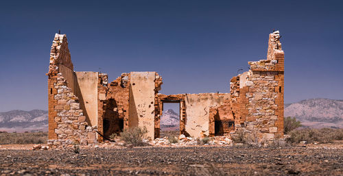 Old building against clear blue sky