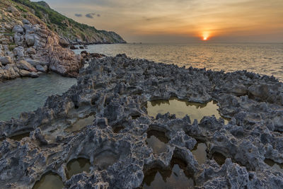 Scenic view of sea against sky during sunset