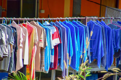 Multi colored flags hanging in store for sale at market stall